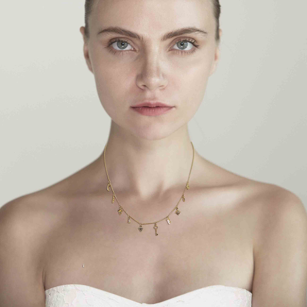 Gold Necklace With Stationed Charms