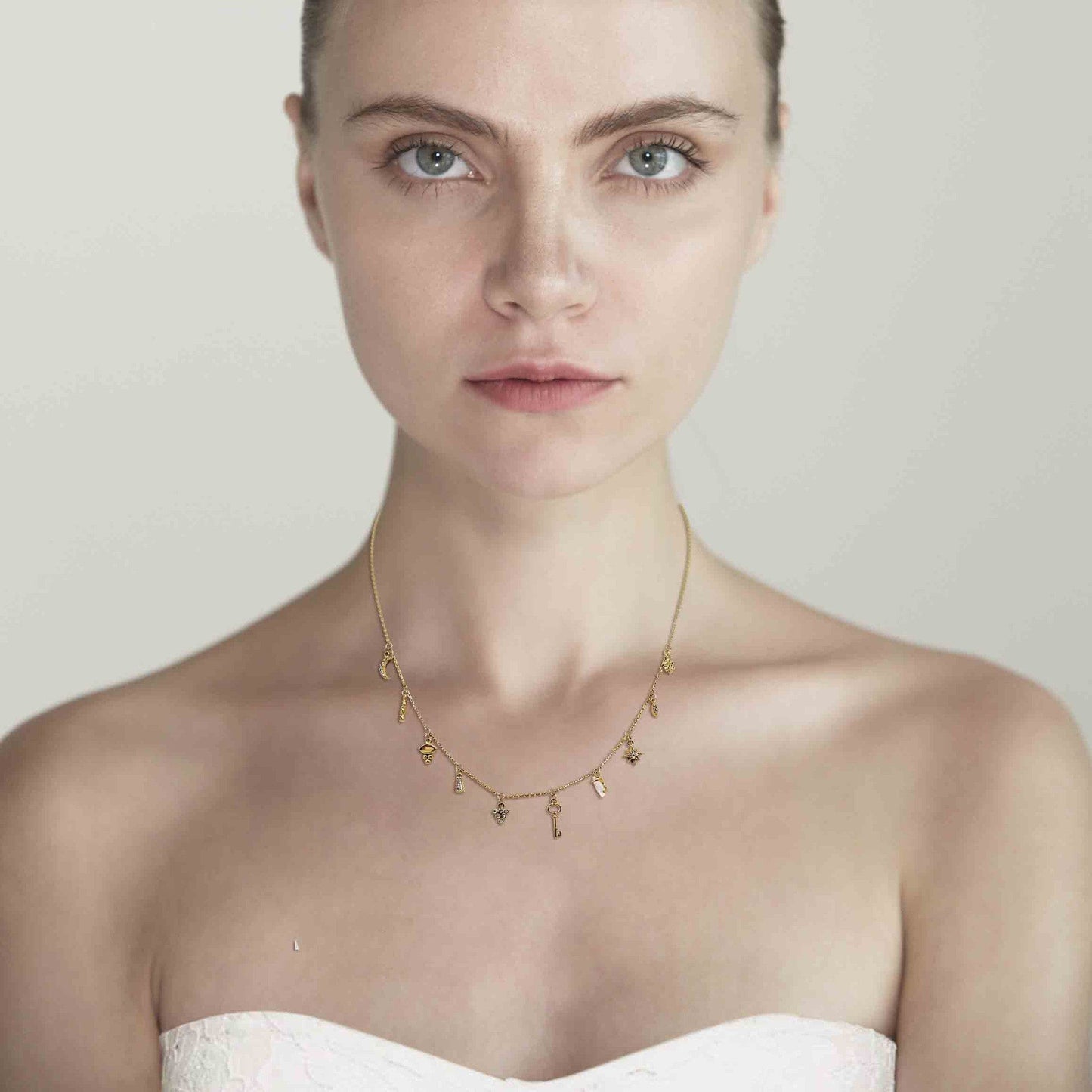 Gold Necklace With Stationed Charms